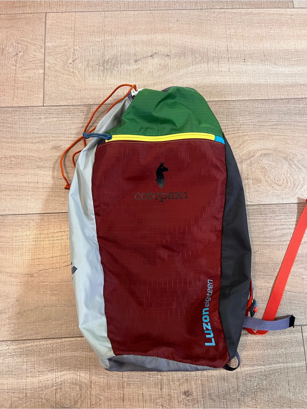 cotopaxi Colorblock Sling Pack in Red, Green, Gray and Black